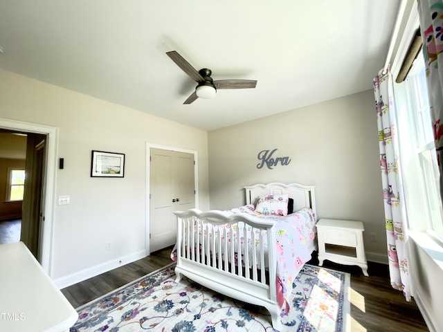 bedroom featuring ceiling fan and dark wood-type flooring