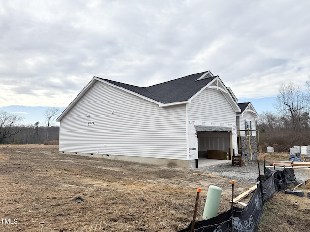 view of side of property with a garage