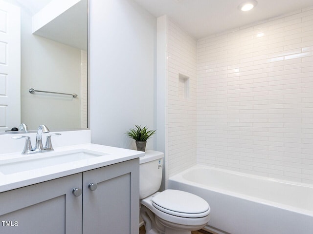 full bathroom featuring  shower combination, vanity, and toilet