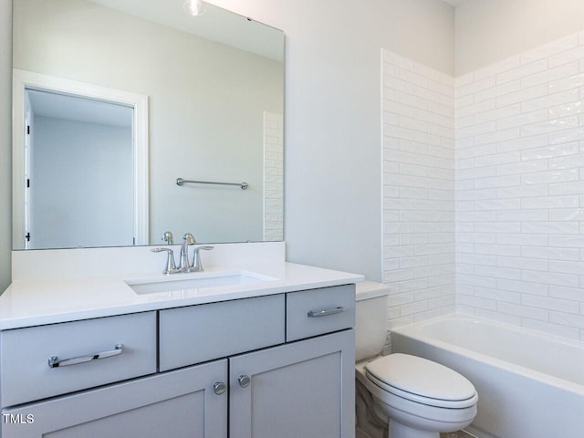 full bath featuring vanity and toilet