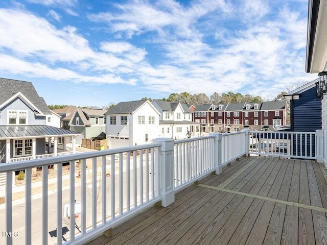 wooden deck with a residential view