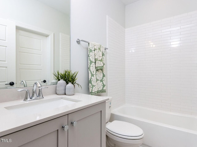 full bath with toilet, vanity, and bathing tub / shower combination