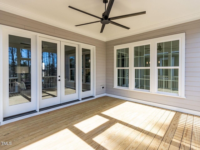 deck featuring french doors and a ceiling fan