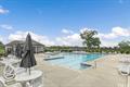 view of swimming pool with a beach view and a water view