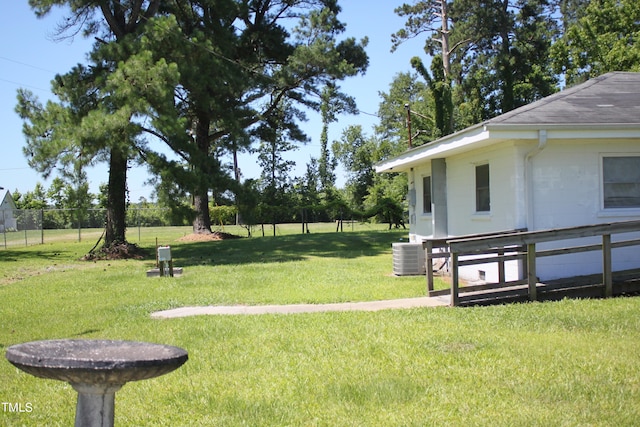 view of yard featuring central air condition unit