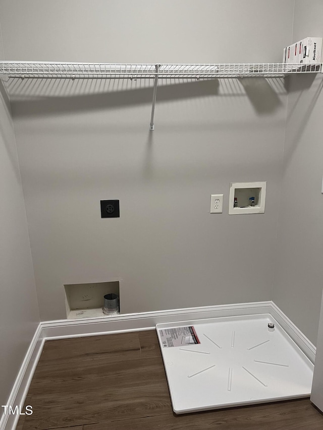 washroom featuring hookup for a washing machine, dark hardwood / wood-style floors, and electric dryer hookup