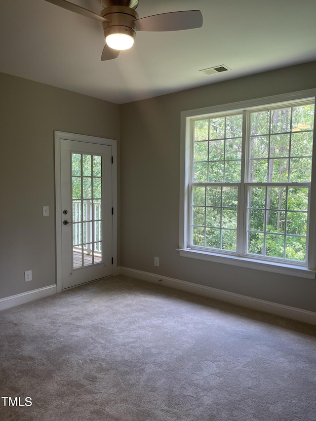 carpeted empty room with ceiling fan