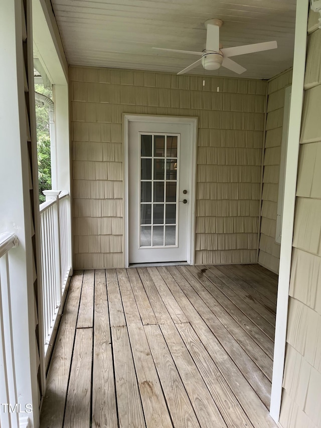 wooden deck featuring ceiling fan