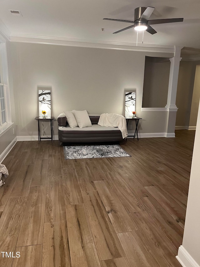 unfurnished room with wood-type flooring, ceiling fan, and crown molding