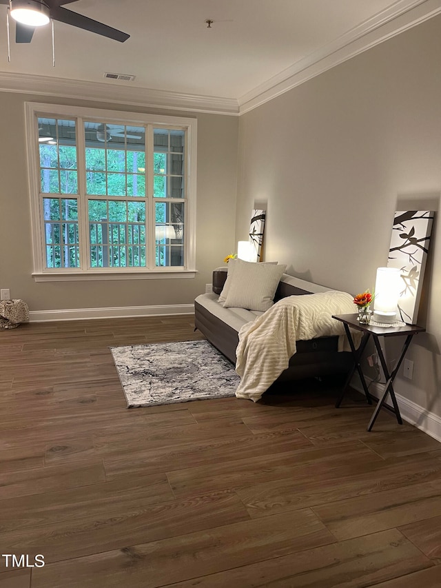 bedroom featuring ceiling fan, crown molding, and dark hardwood / wood-style floors