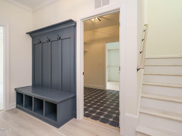 mudroom with ornamental molding