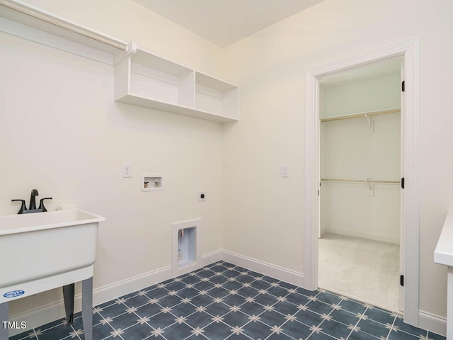 clothes washing area with sink, hookup for an electric dryer, and washer hookup