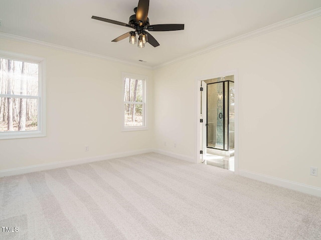 unfurnished room featuring light colored carpet, ceiling fan, and ornamental molding