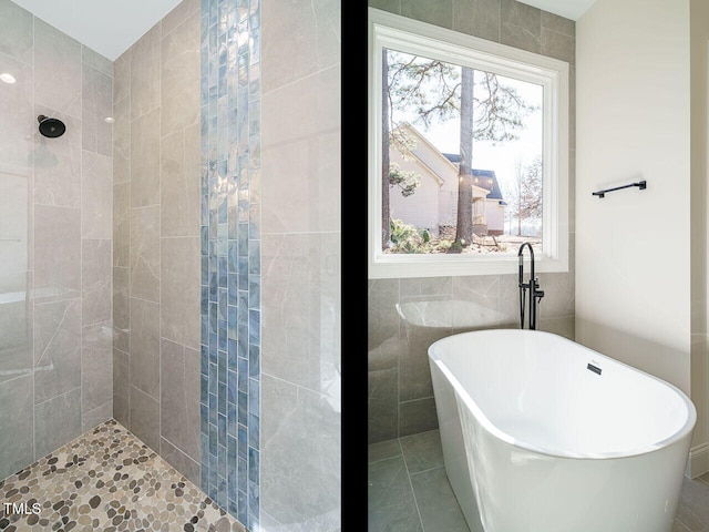 bathroom featuring tile walls, tile patterned floors, and independent shower and bath