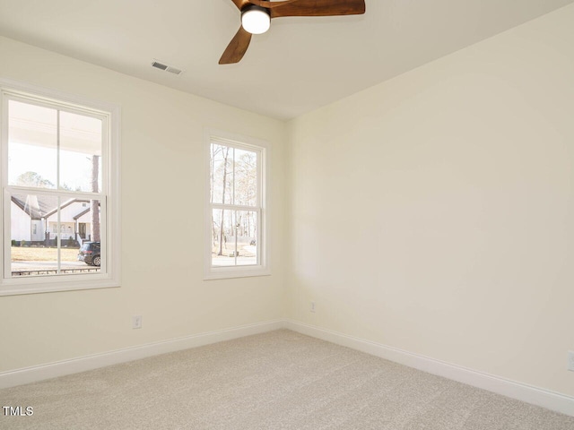 unfurnished room with carpet floors and ceiling fan