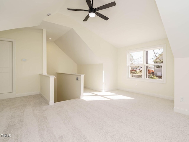 bonus room featuring ceiling fan, light colored carpet, and vaulted ceiling