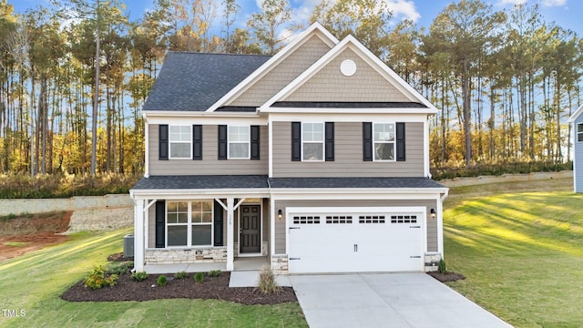 craftsman-style home with a garage, cooling unit, and a front lawn