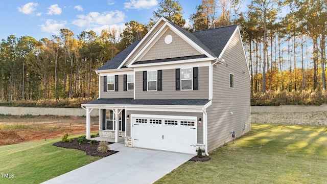 view of front of house featuring a garage and a front lawn