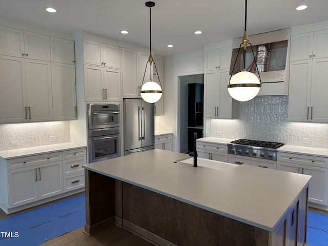 kitchen with stainless steel appliances, light countertops, recessed lighting, and backsplash