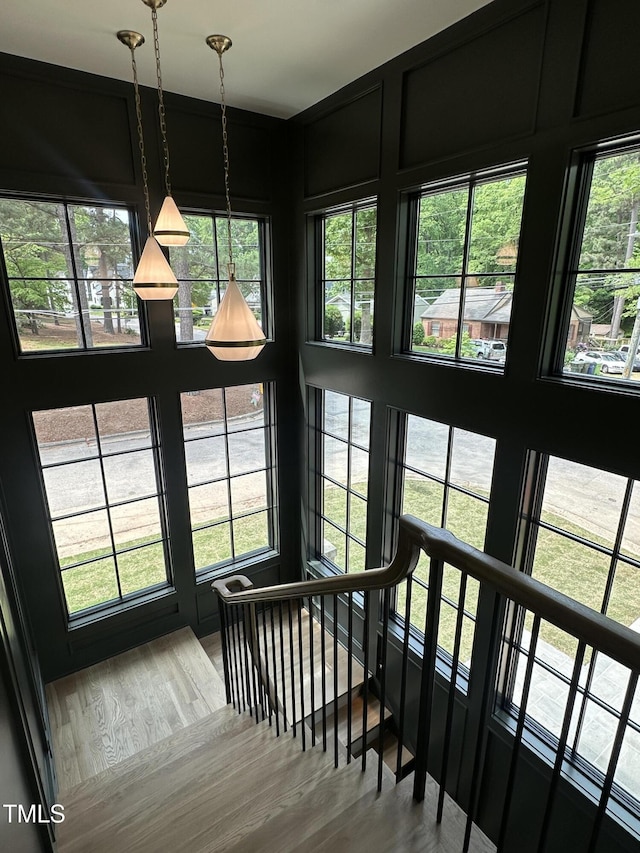 stairway featuring wood finished floors