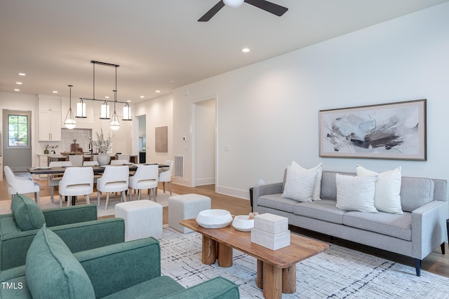1000 Marilyn Dr, Raleigh, NC 27607 - living room featuring a ceiling fan, recessed lighting, light wood finished floors, and baseboards