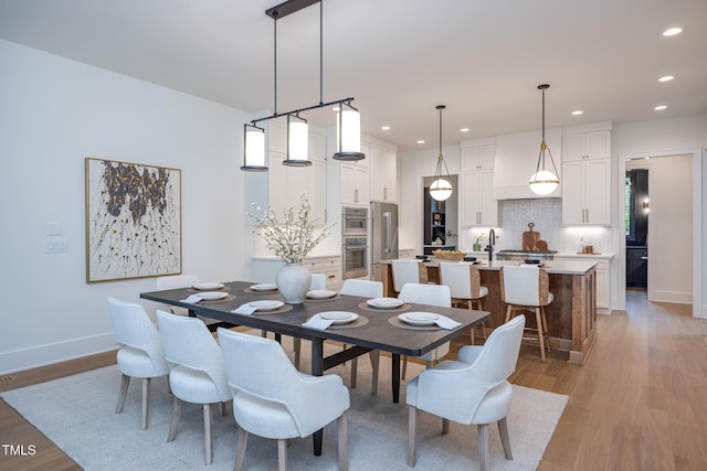 1000 Marilyn Dr, Raleigh, NC 27607 - dining area with light wood-style floors, recessed lighting, and baseboards