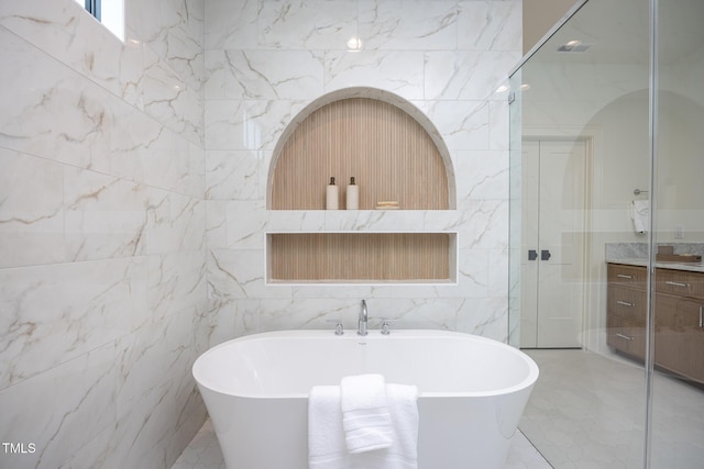 1000 Marilyn Dr, Raleigh, NC 27607 - bathroom with tile walls, vanity, a freestanding bath, and a walk in shower