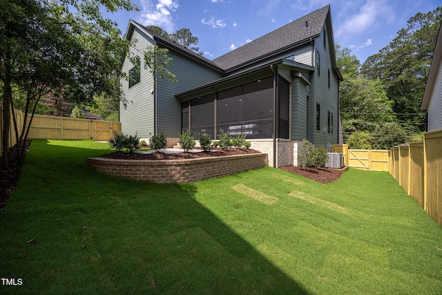 1000 Marilyn Dr, Raleigh, NC 27607 - rear view of house featuring a sunroom, a gate, and central AC