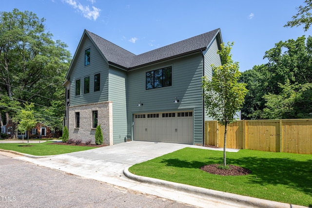 1000 Marilyn Dr, Raleigh, NC 27607 - view of front of home with an attached garage, concrete driveway, and roof with shingles
