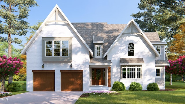 view of front of house featuring a garage and a front lawn