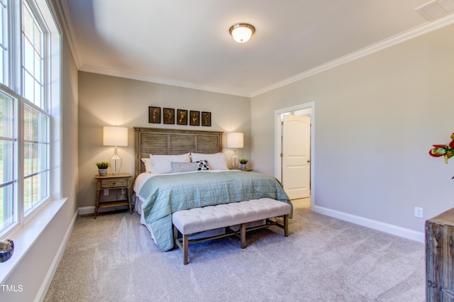 bedroom featuring baseboards, crown molding, visible vents, and light colored carpet