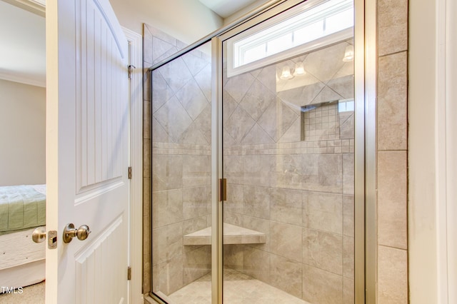 full bathroom featuring ornamental molding and a stall shower