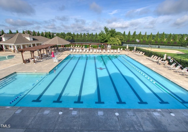 community pool featuring a pergola, a patio, a gazebo, and fence