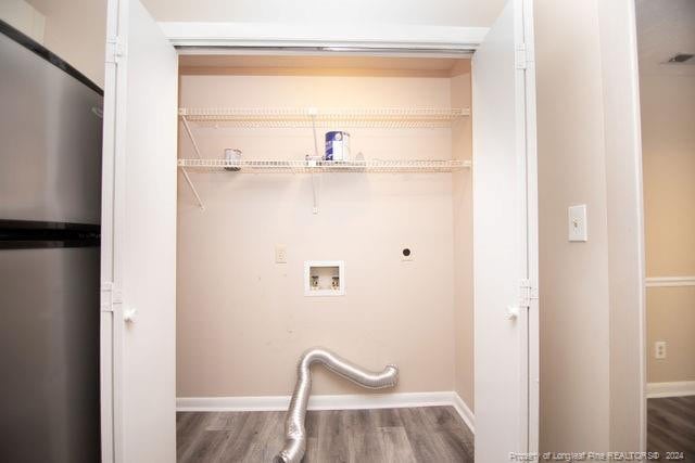 laundry room with hardwood / wood-style floors, washer hookup, and hookup for an electric dryer