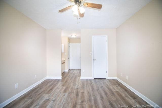 spare room featuring light hardwood / wood-style floors and ceiling fan