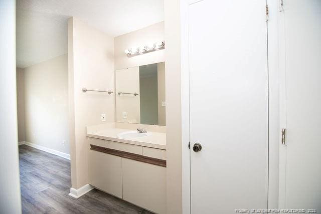 bathroom featuring hardwood / wood-style floors and vanity