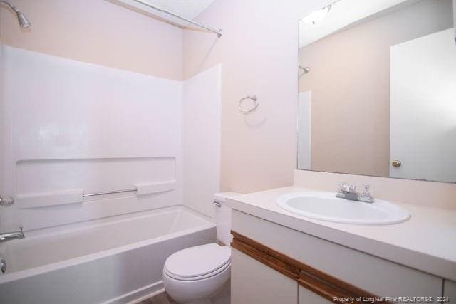 full bathroom featuring vanity, toilet, and shower / washtub combination