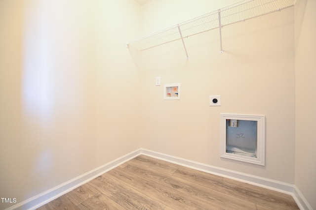 clothes washing area featuring washer hookup, hardwood / wood-style floors, and hookup for an electric dryer