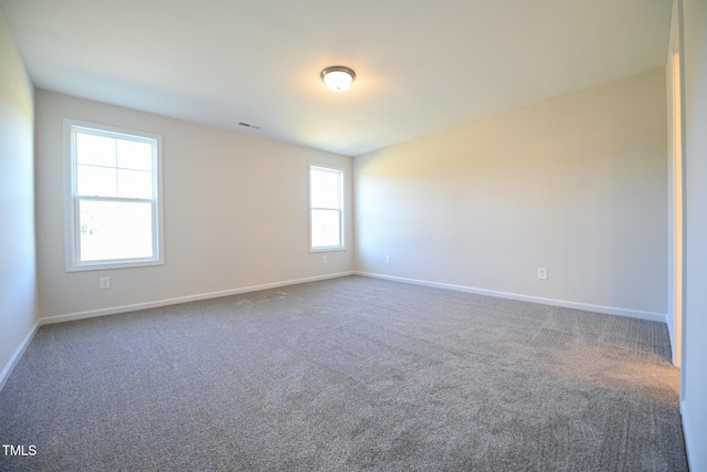 empty room featuring carpet floors