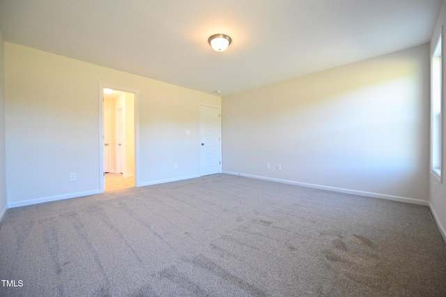 unfurnished room with carpet floors