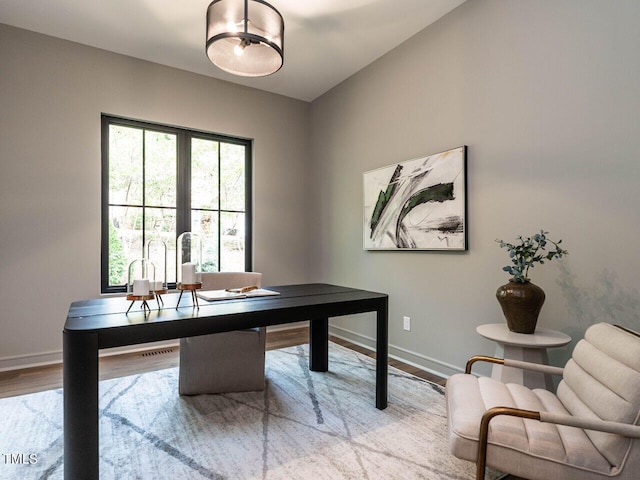 office area with hardwood / wood-style floors