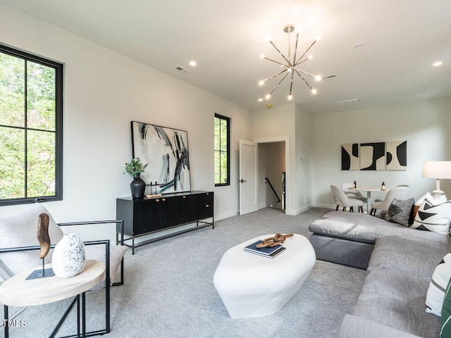 living room featuring a chandelier and light colored carpet