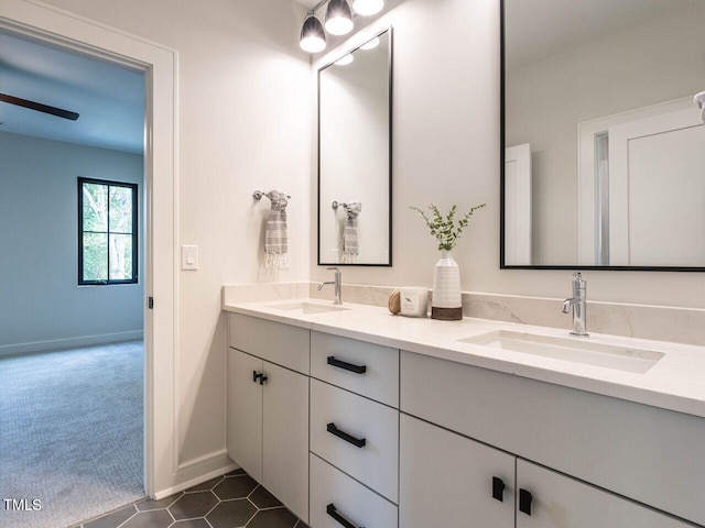 bathroom with tile patterned floors and vanity