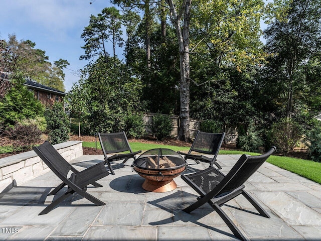 view of patio / terrace with an outdoor fire pit