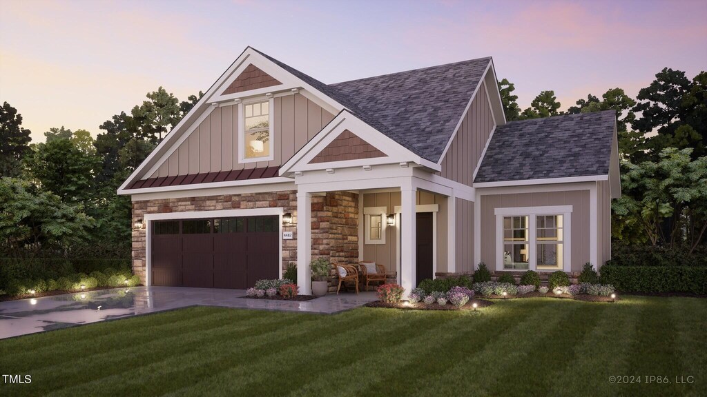1005 Bridgeforth Ln, Durham, NC 27713 - craftsman inspired home with a shingled roof, driveway, a lawn, a standing seam roof, and an attached garage