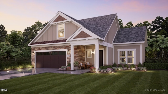 craftsman house with a yard and a garage