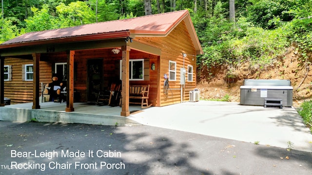 exterior space featuring central AC unit and a porch