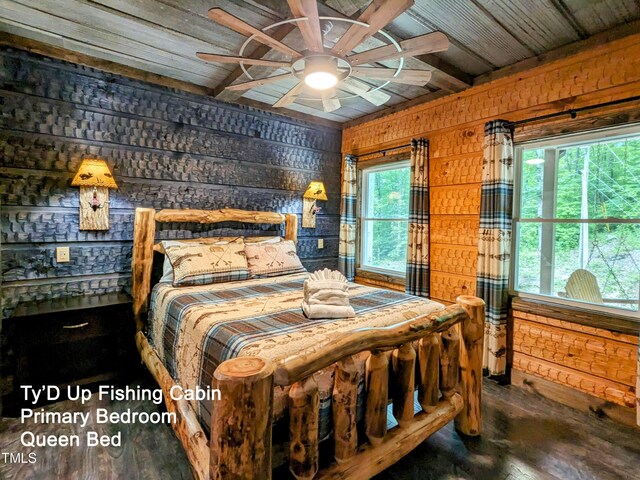 bedroom with wooden walls, hardwood / wood-style flooring, wood ceiling, and multiple windows