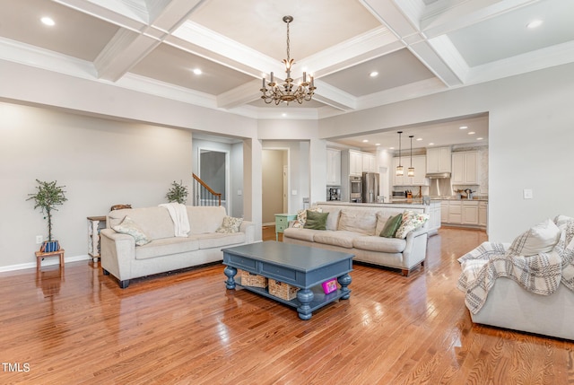 1329 Endgame Ct, Wake Forest, NC 27587 - living room with a chandelier, light wood finished floors, coffered ceiling, beam ceiling, and stairs
