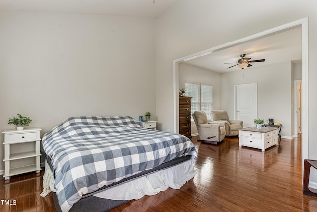 bedroom featuring lofted ceiling, dark hardwood / wood-style floors, and ceiling fan